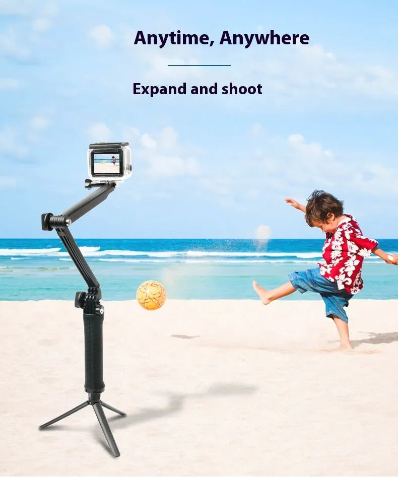 Black portable folding camera tripod stand for GoPro Hero action cameras on a flat surface.