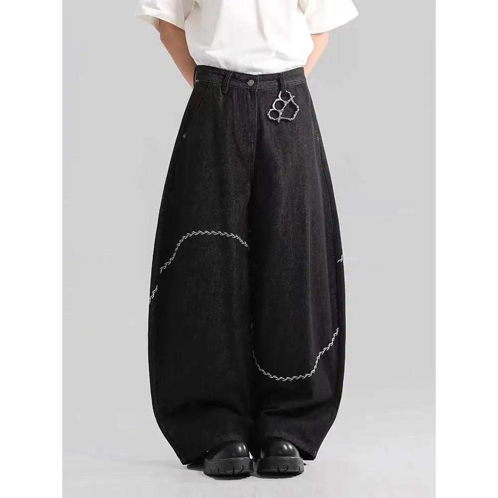 Black straight-leg denim trousers with micro-elastic waist and zip fly closure