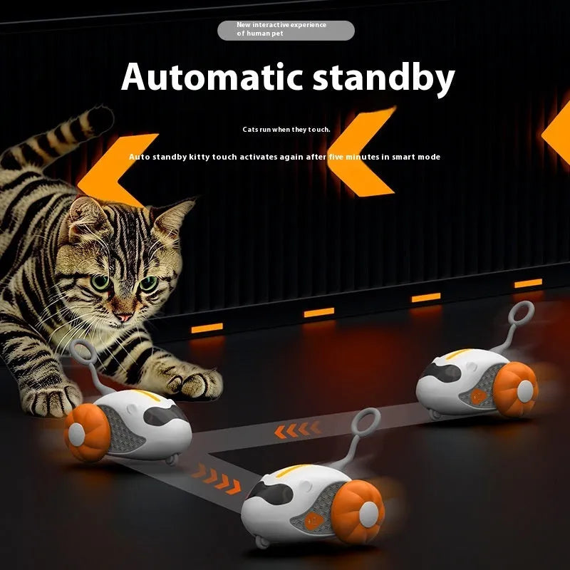 Charging Cat Teaser remote control toy with feather attachment in orange plastic body on floor