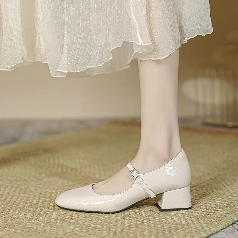 Women's square toe patent leather Mary Jane shoes with buckle and pearl detail, mid heel, black colour