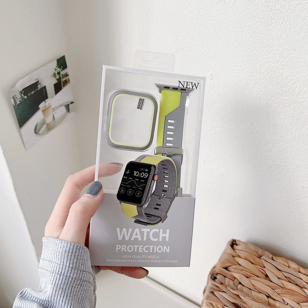 Two-tone silicone protective case for Apple Watch in black and white on a flat surface