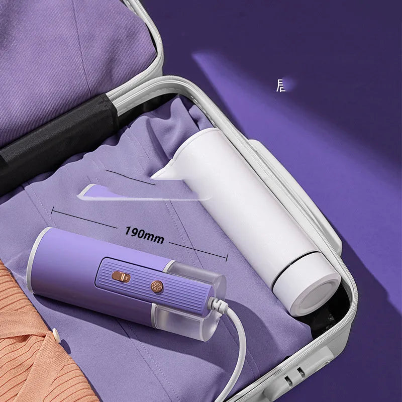 Portable handheld garment steamer in grey lotus root purple colour with foldable design and water reservoir