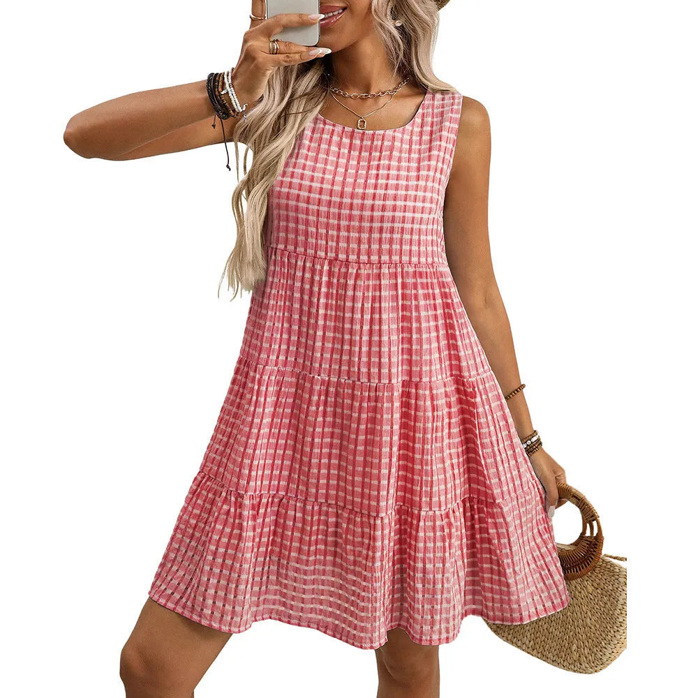 Women's sleeveless plaid dress with high waist and an oversized swing skirt in a light blue colour.