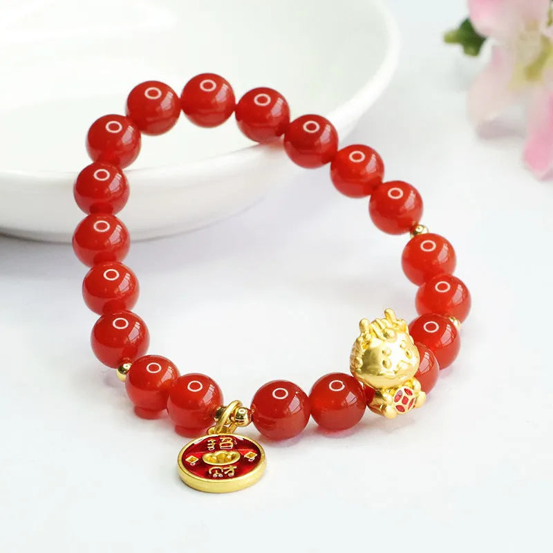 Close-up of a red agate bead dragon zodiac bracelet on a wrist, showing 8mm beads.