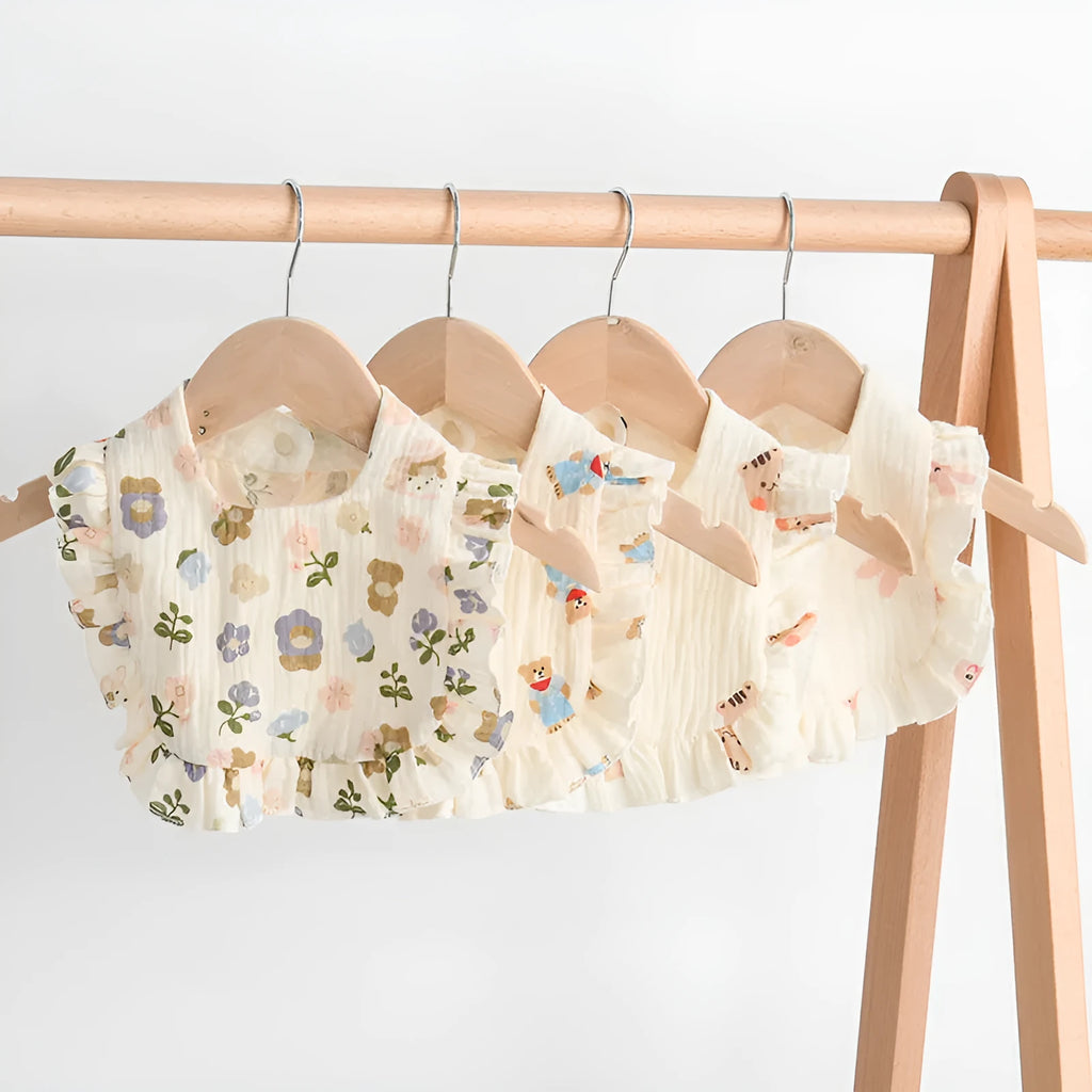 Pack of six baby muslin bibs with animal bandana prints and adjustable snap fasteners