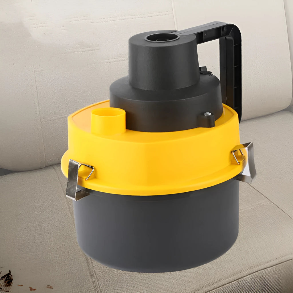 Yellow 12V wet and dry car cleaner with ABS body on a grey surface with nozzles and hose visible