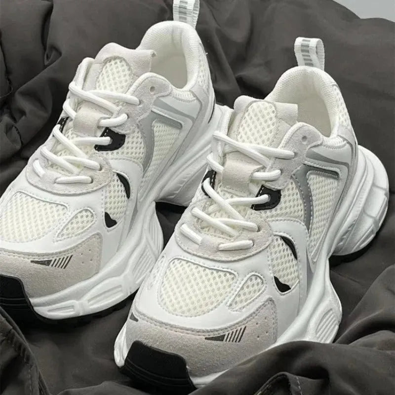 Beige mesh platform casual sports shoes with a wedge heel and front lace-up design on a rubber sole.