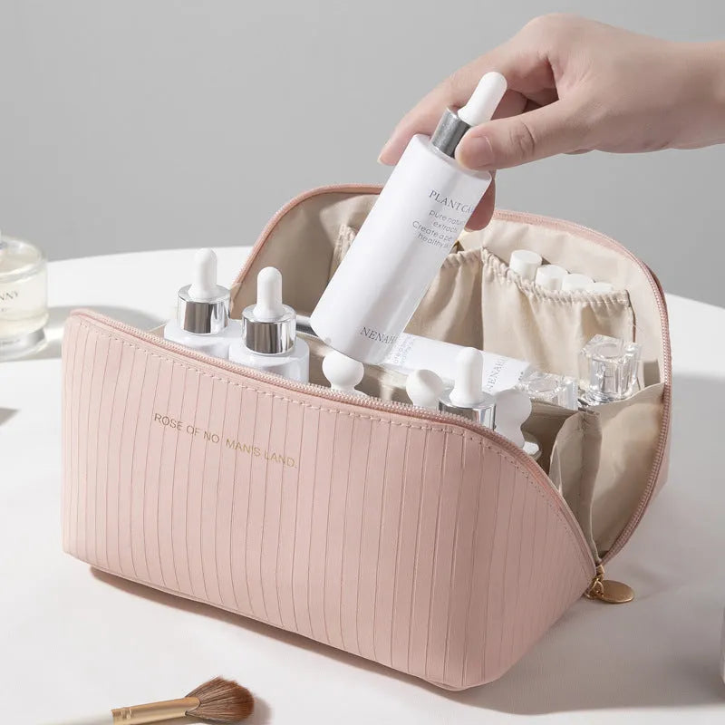 Vertical pattern pillow makeup bag in a cubic shape with large capacity for travel storage.