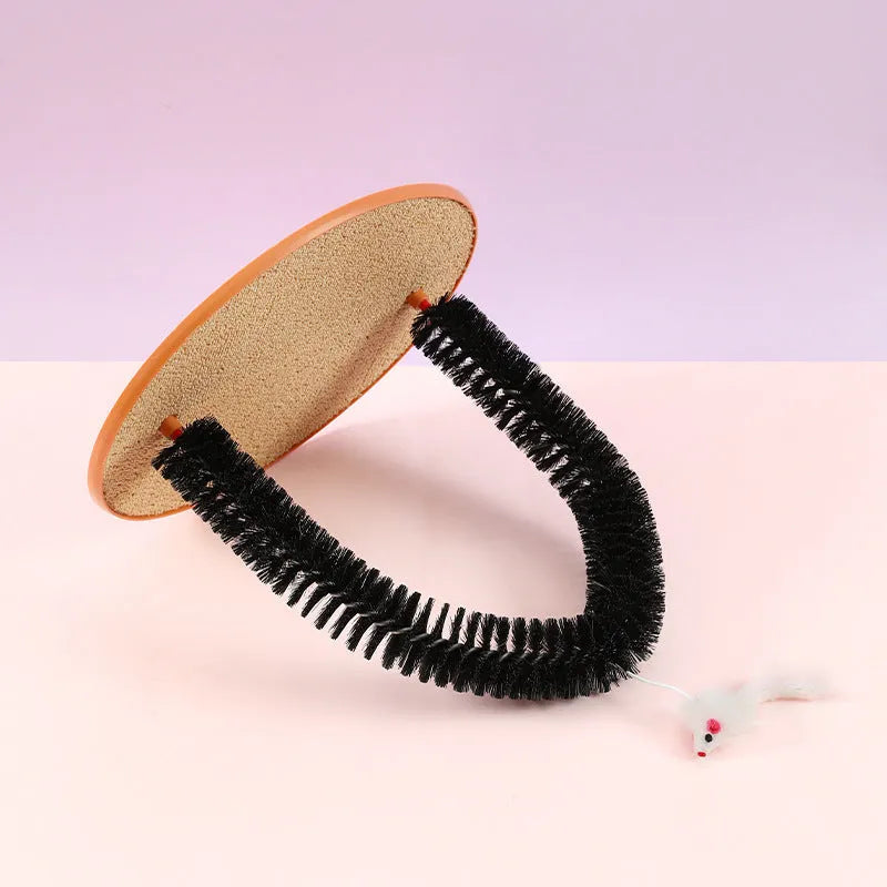 Black arch-shaped plastic cat grooming device with a mop and scratching surfaces, featuring a plush mouse toy.