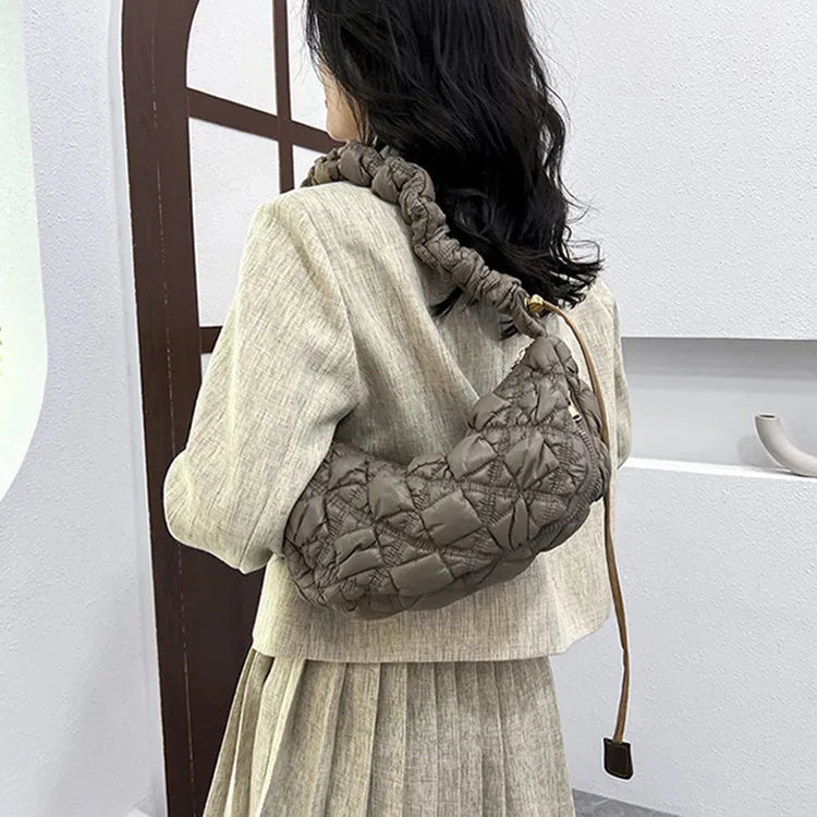 Light beige women's casual nylon shoulder messenger bag with a long adjustable strap.