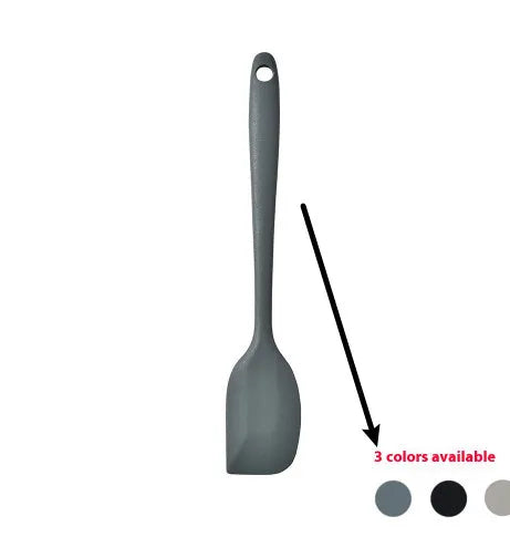 Silicone kitchen utensil set with twelve tools in a rotating white storage caddy on a counter.