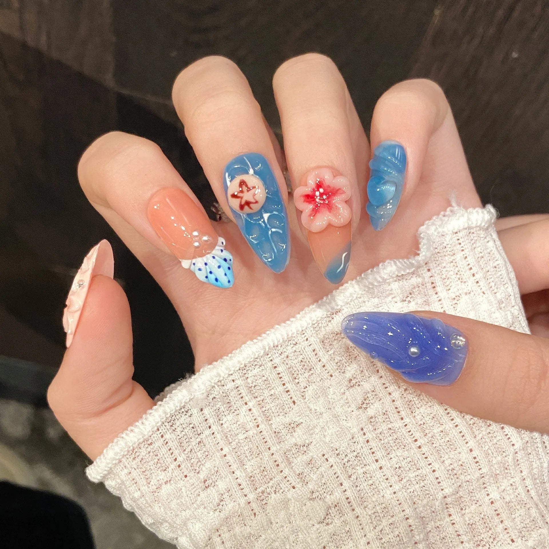 Three-dimensional carved plastic jellyfish wearable armour in almond nail colour for cosplay.