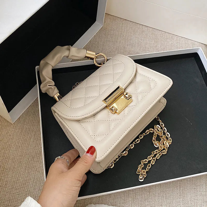 Korean-style small square shoulder bag in purple with chain detail and soft PU construction