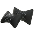 Pair of black diamond-quilted car headrest pillows with blue stitching for neck support.