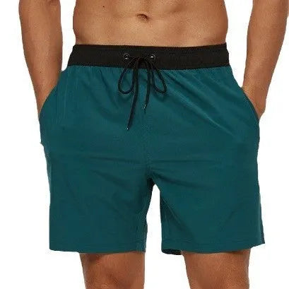 Men's blue running shorts with zipper pocket and drawstring waist detail for fitness activities