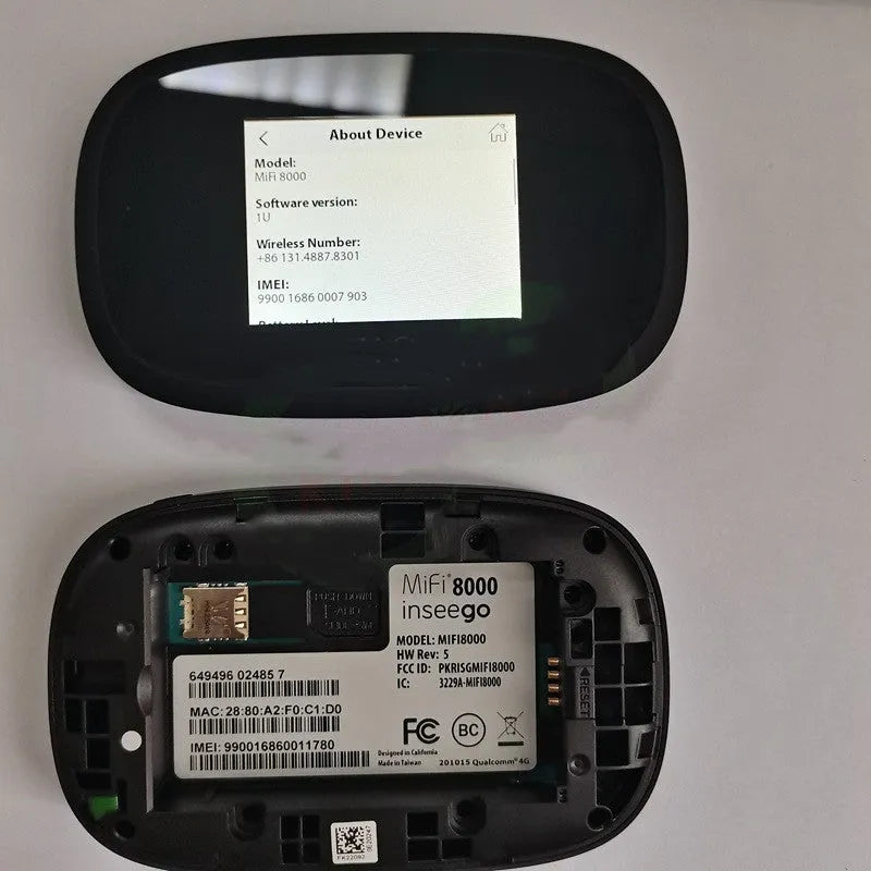 Black Full Network mifi8000 4G portable wireless router with battery and USB cable on a table