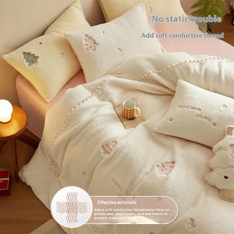 Milk fibre four-piece bedding set with green Christmas tree pattern on a duvet cover and pillowcases.