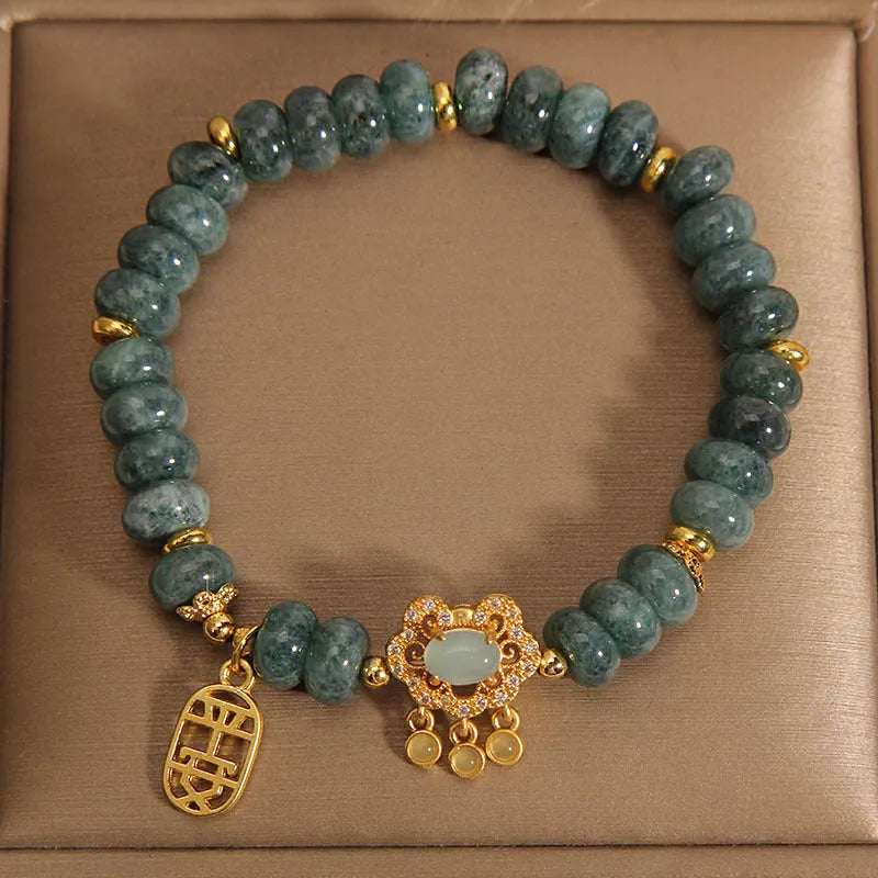 Women's natural emerald jade bracelet with abacus beads and safety lock closure
