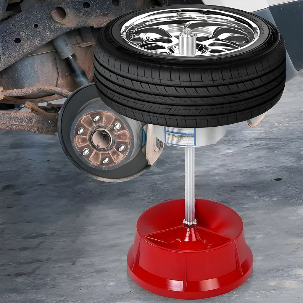 Portable aluminium hub balancer for car wheels with a bull's eye level and enamel-finished base.