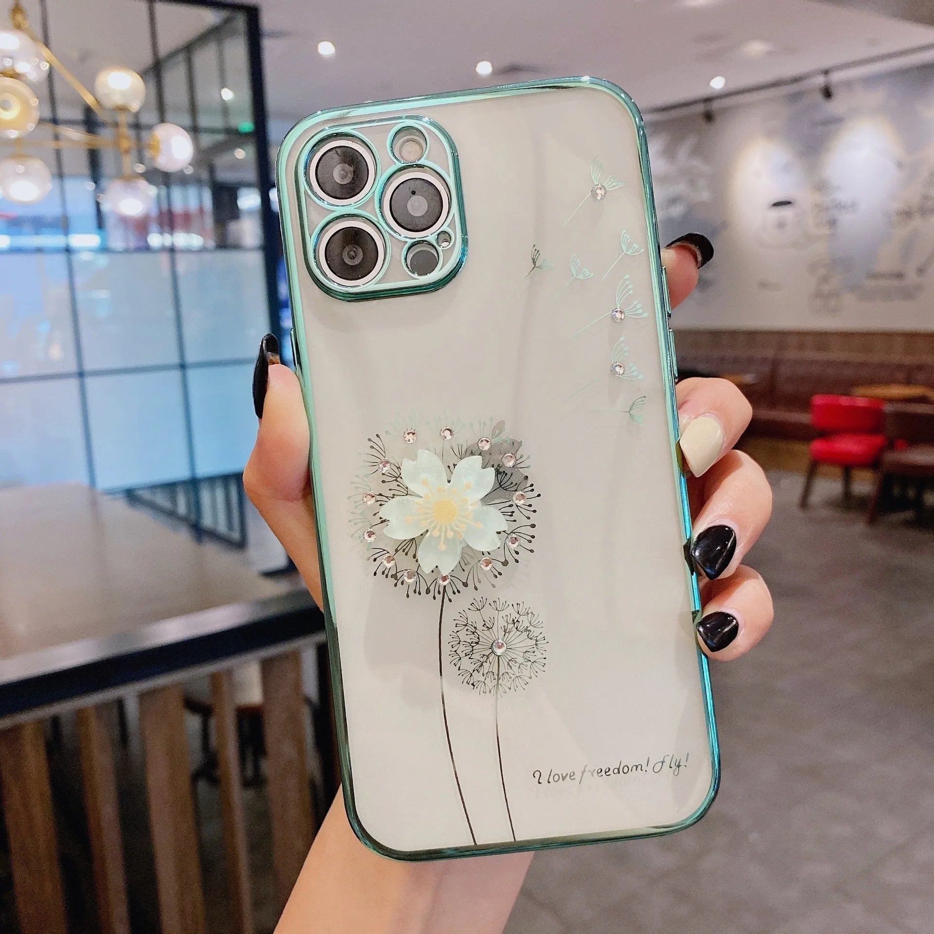 Green iPhone case with 3D floral design and extended rotating kickstand, showing built-in screen protector.