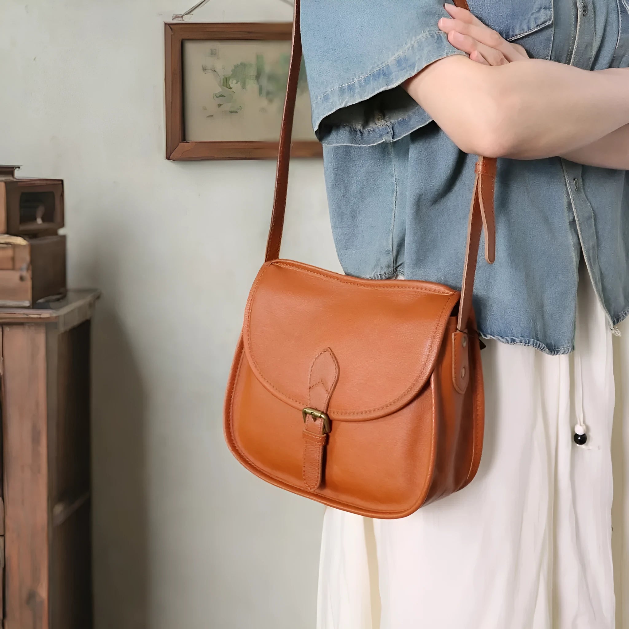 Brown genuine cowhide leather retro messenger bag with flap closure and crossbody strap