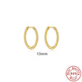 A pair of twisted sterling silver round ring earrings in a gold colour finish, shown at 13mm size.