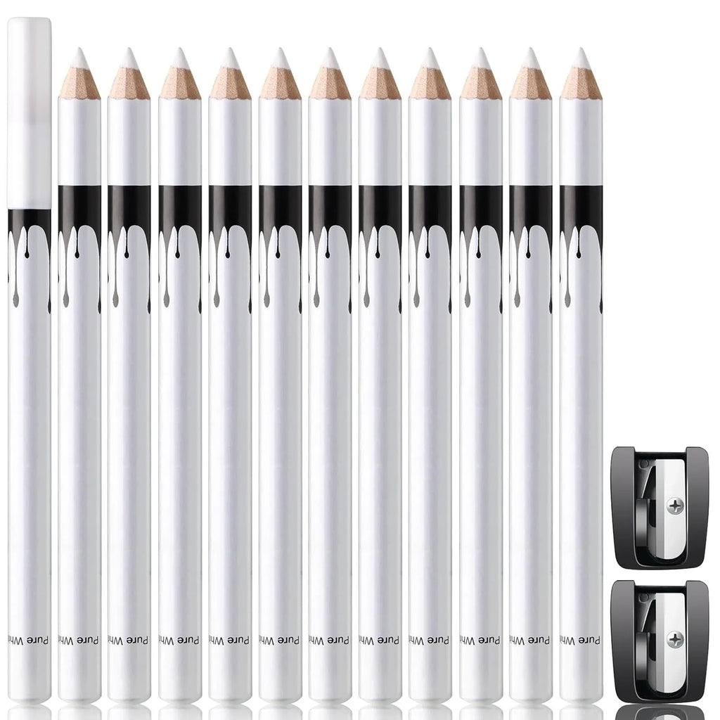 12 white and black retractable eyeliner pencils and a sharpener laid out on a flat surface.