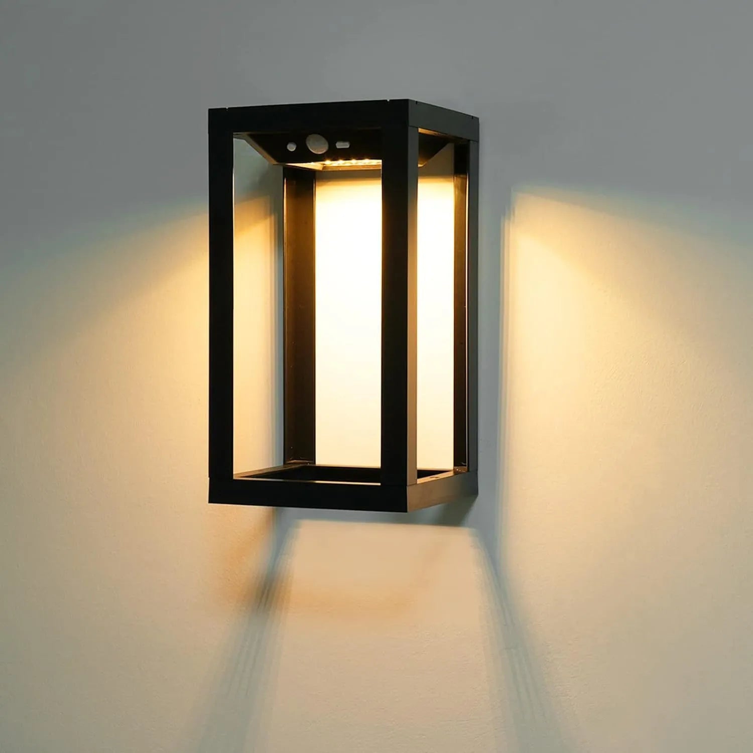 Modern plastic solar-powered outdoor wall lamp with IP65 waterproof rating for garden and villa use.