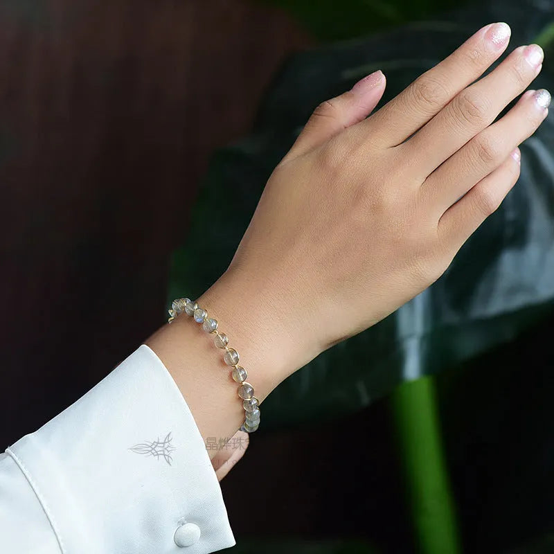 Blue moonstone bracelet with 14K gilded metal celestial design