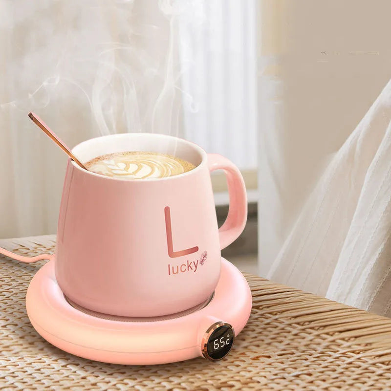 White USB-powered coffee mug warmer coaster on a wooden desk