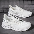 Women's FlyKnit mesh casual trainers in black, showing round toe and flat heel design.