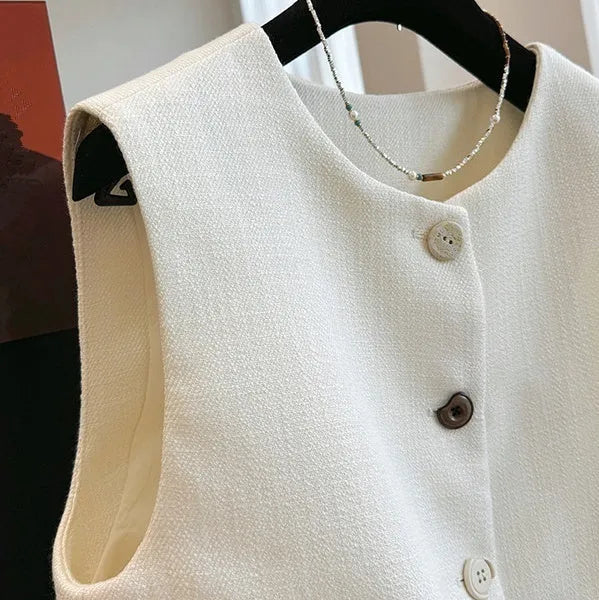 Women's sleeveless bandage dress vest in polyester with round neck, shown in milky white and black colours