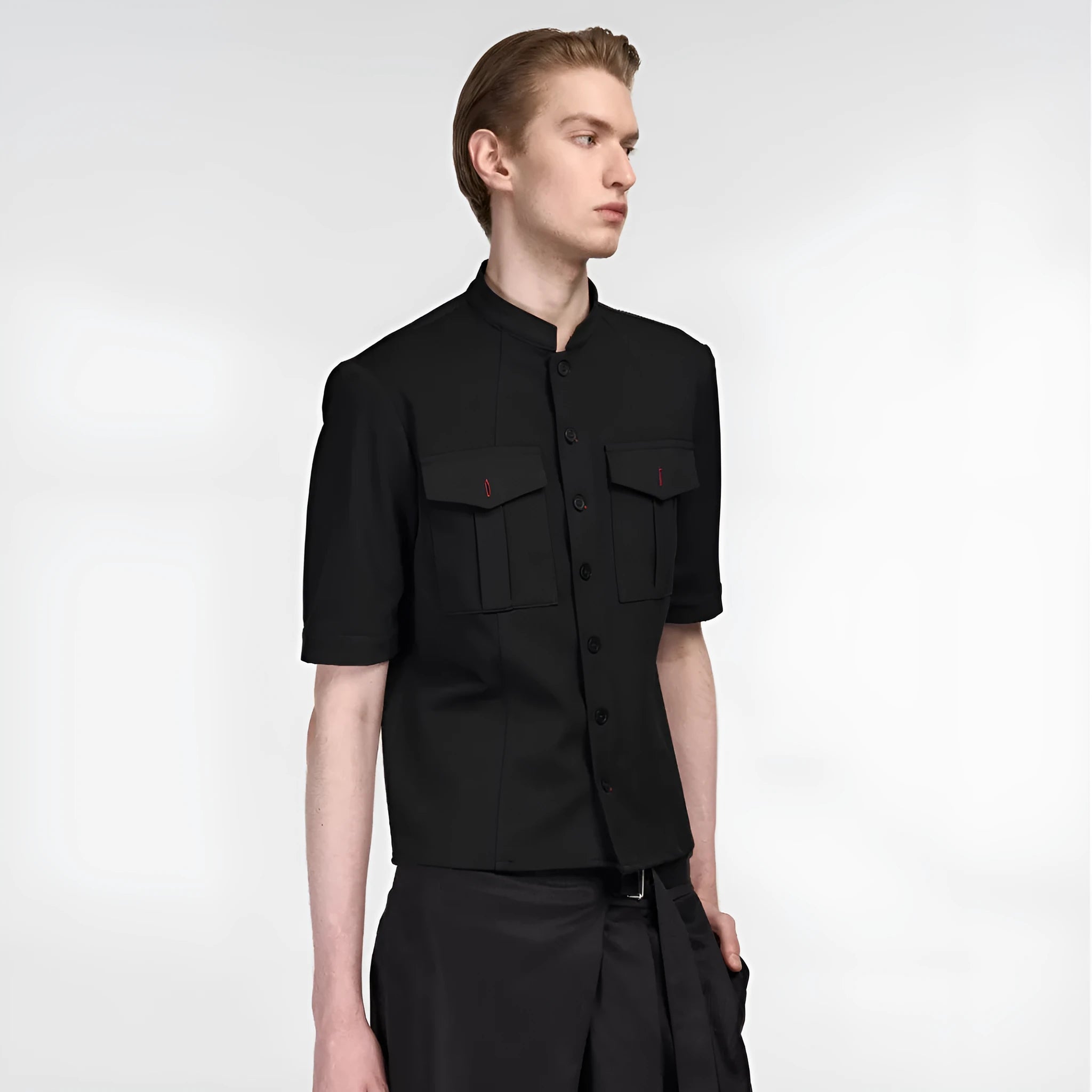 Handmade black half-sleeve hunting shirt with a shirt collar and single-breasted placket on a hanger.