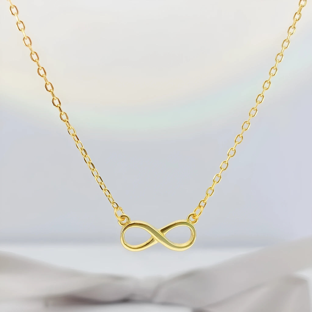 925 silver through-the-body pendant necklace with adjustable chain in platinum finish on collarbone