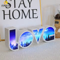 Colourful LED LOVE word light with rainbow halo lampshade for romantic decoration.