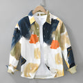 Loose fit cotton cardigan top with long sleeves in a printed colour design, shown on a hanger.
