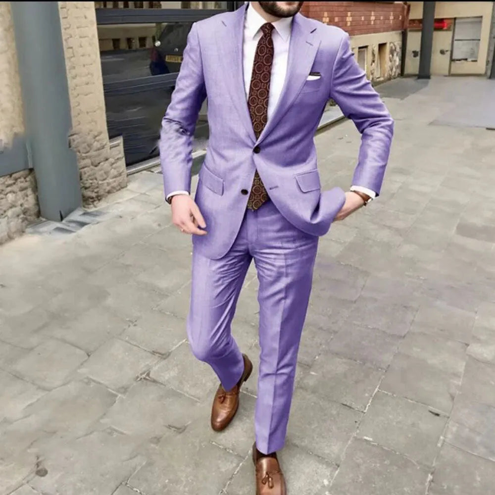 Men's slim fit two-button business suit jacket and trousers on a hanger