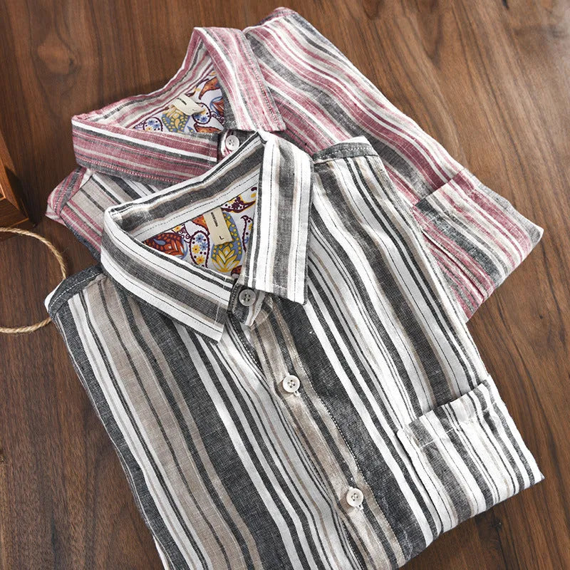 A man wearing a red and grey striped linen casual shirt with long sleeves and a loose fit.