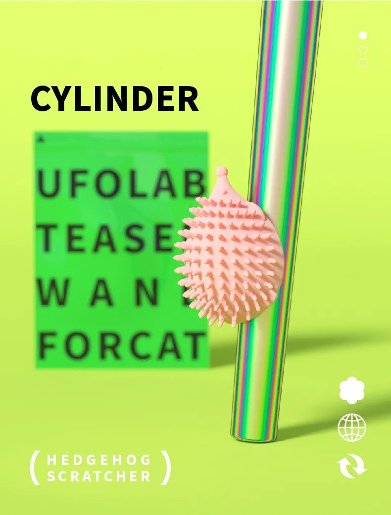 Green cat corner scratcher with plastic base and long teaser stick on a light background
