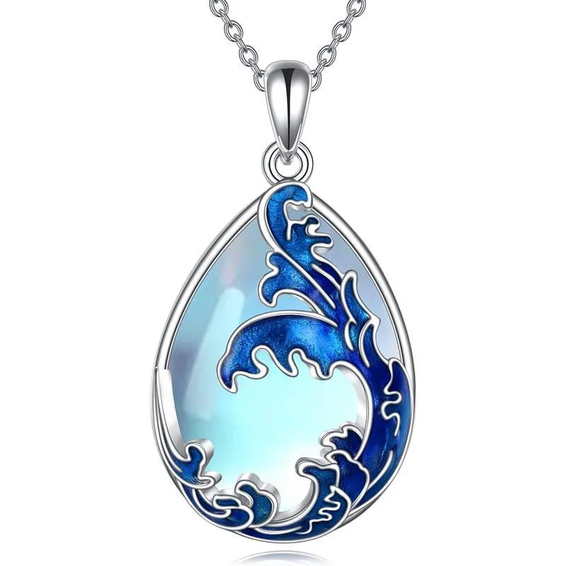 Close-up of a moonstone blue alloy heart pendant necklace on a 20-inch chain.