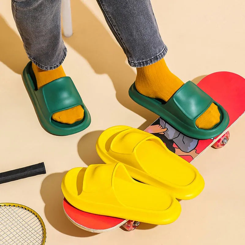 Pair of thick-soled EVA flip-flop slippers in a chosen colour on a plain background.