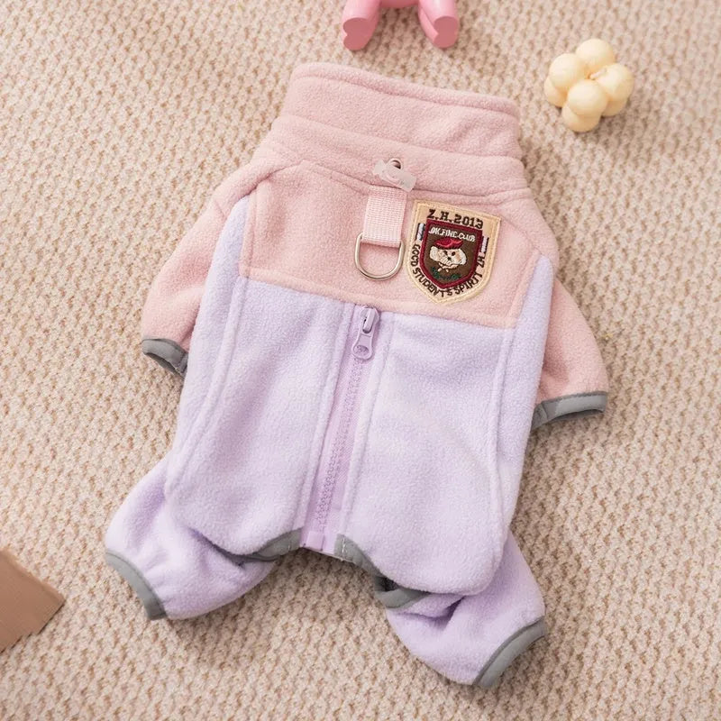 Four-legged fleece jacket for cats and small dogs in colour block design with badge patch, showing front zipper and elastic cuffs.