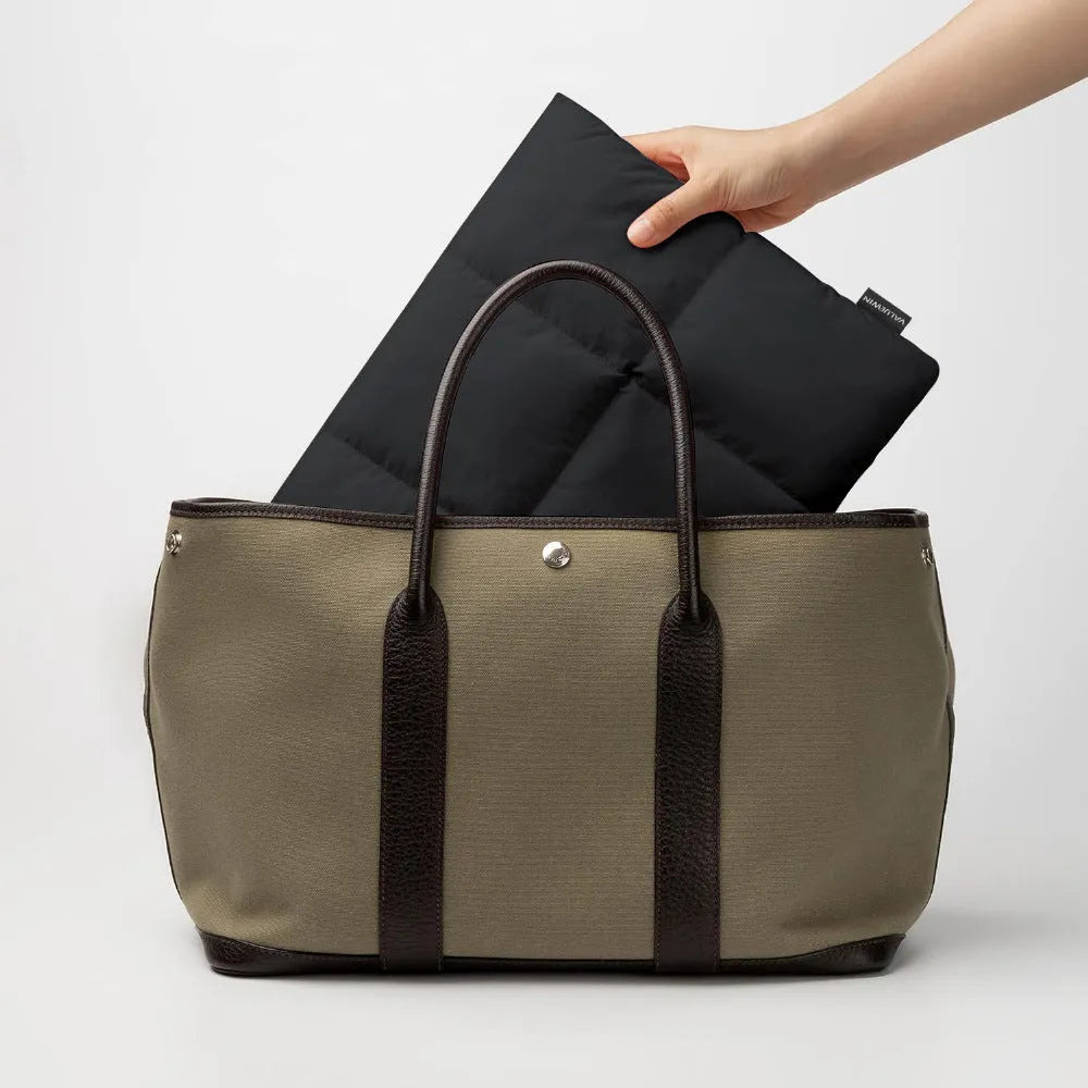 Soft fluffy laptop sleeve in black or khaki for 13 to 15.6 inch computers with retro sewing thread details