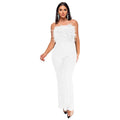 Women's black sleeveless backless jumpsuit with flared legs and sequin decoration.