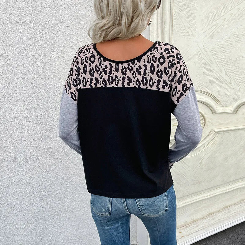 Women's black leopard print patchwork loose fit pullover sweater with round neck and long sleeves