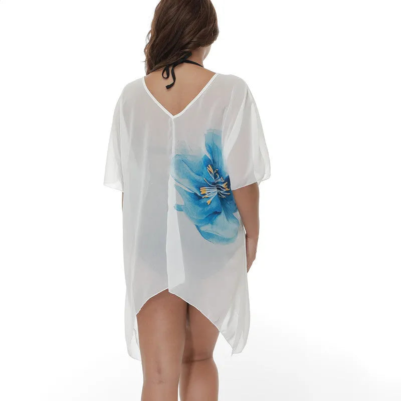 White plus size beach cover-up blouse for women, loose polyester fabric for swimming and sun protection.