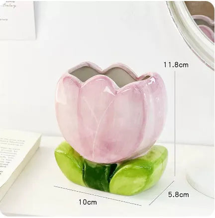 Ceramic pen holder storage box with floral pattern decoration on desktop