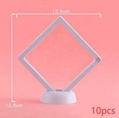 3D floating display case holding a coin suspended between transparent membrane sheets, black frame