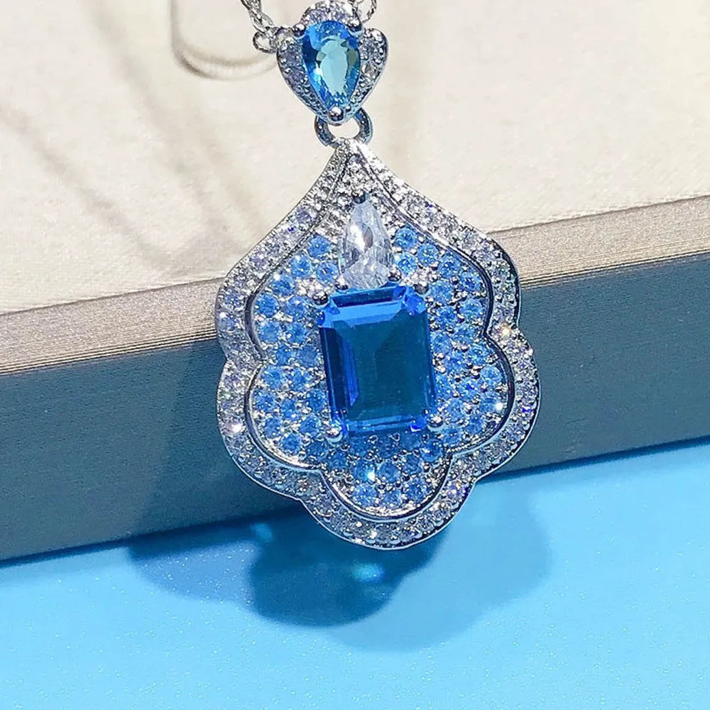 Sea blue geometric copper pendant with aquamarine and topaz mirror finish jewellery piece