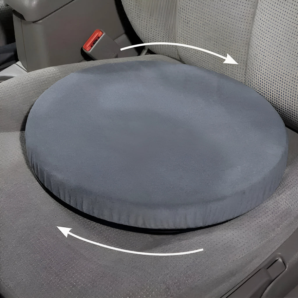 A grey 360-degree rotating car seat cushion on a car seat, showing its non-slip base and plush fabric cover.